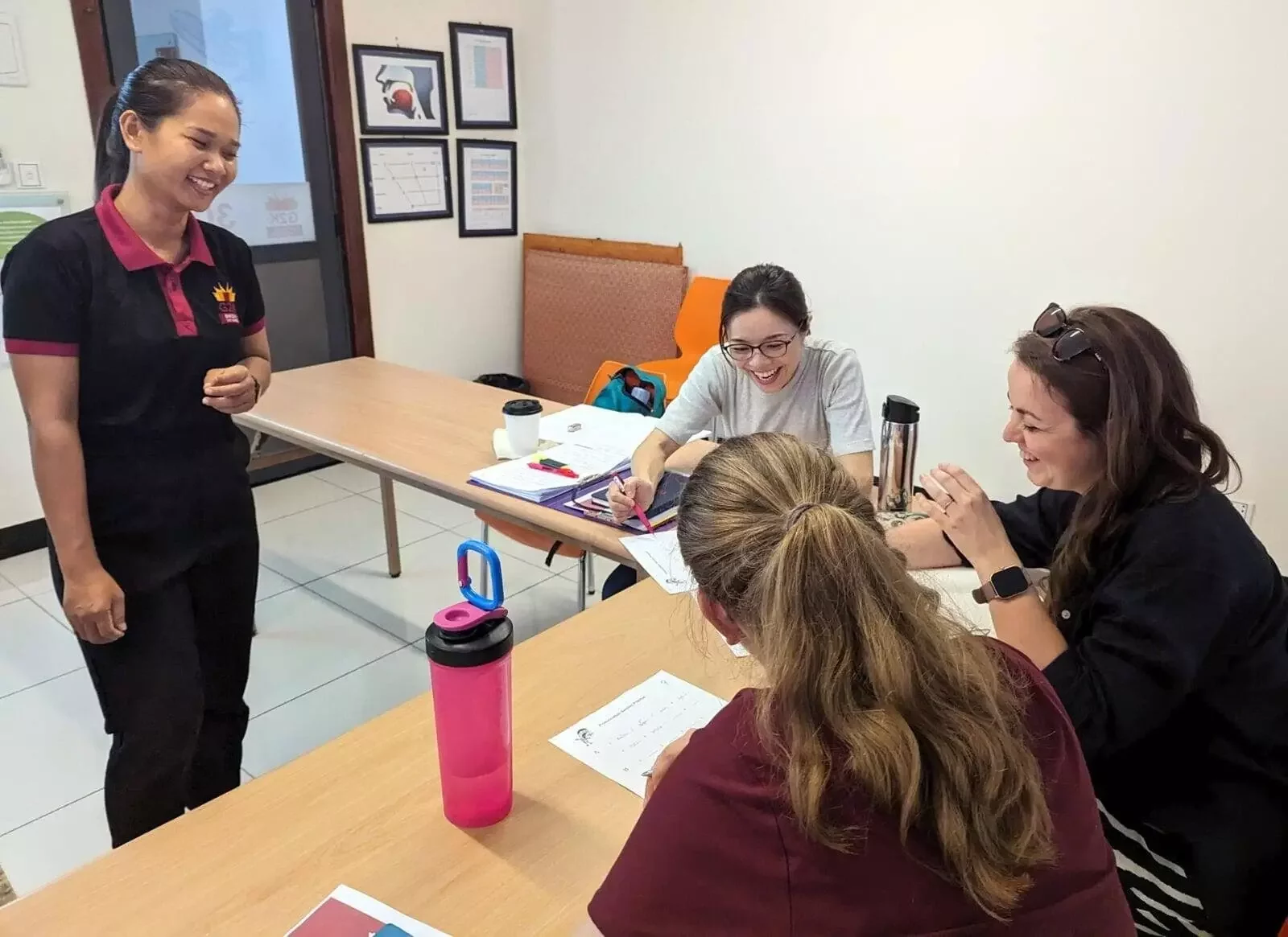 Sokhun teaching a part-time Khmer class